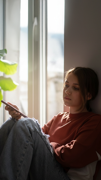 Teen looking at phone
